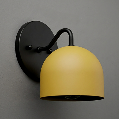 Matte black metal wall sconce with a curved arm and a dome-shaped yellow shade. - SCONCE MODEL NO. 9436