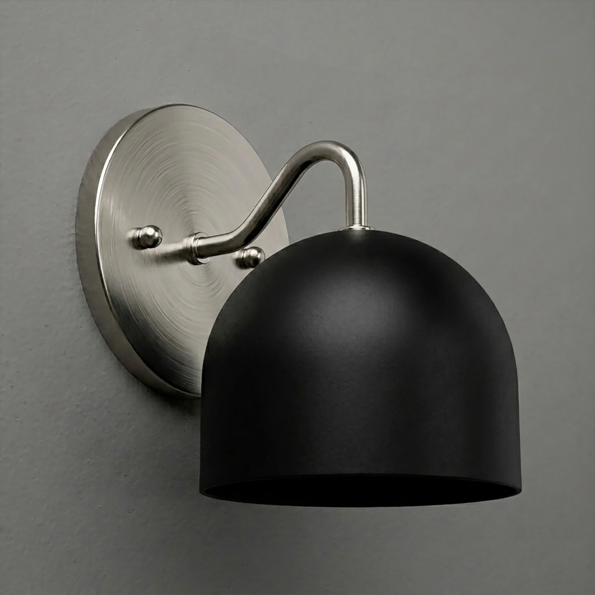Matte black dome-shaped metal sconce with brushed nickel round wall mount and curved arm. - SCONCE MODEL NO. 9436