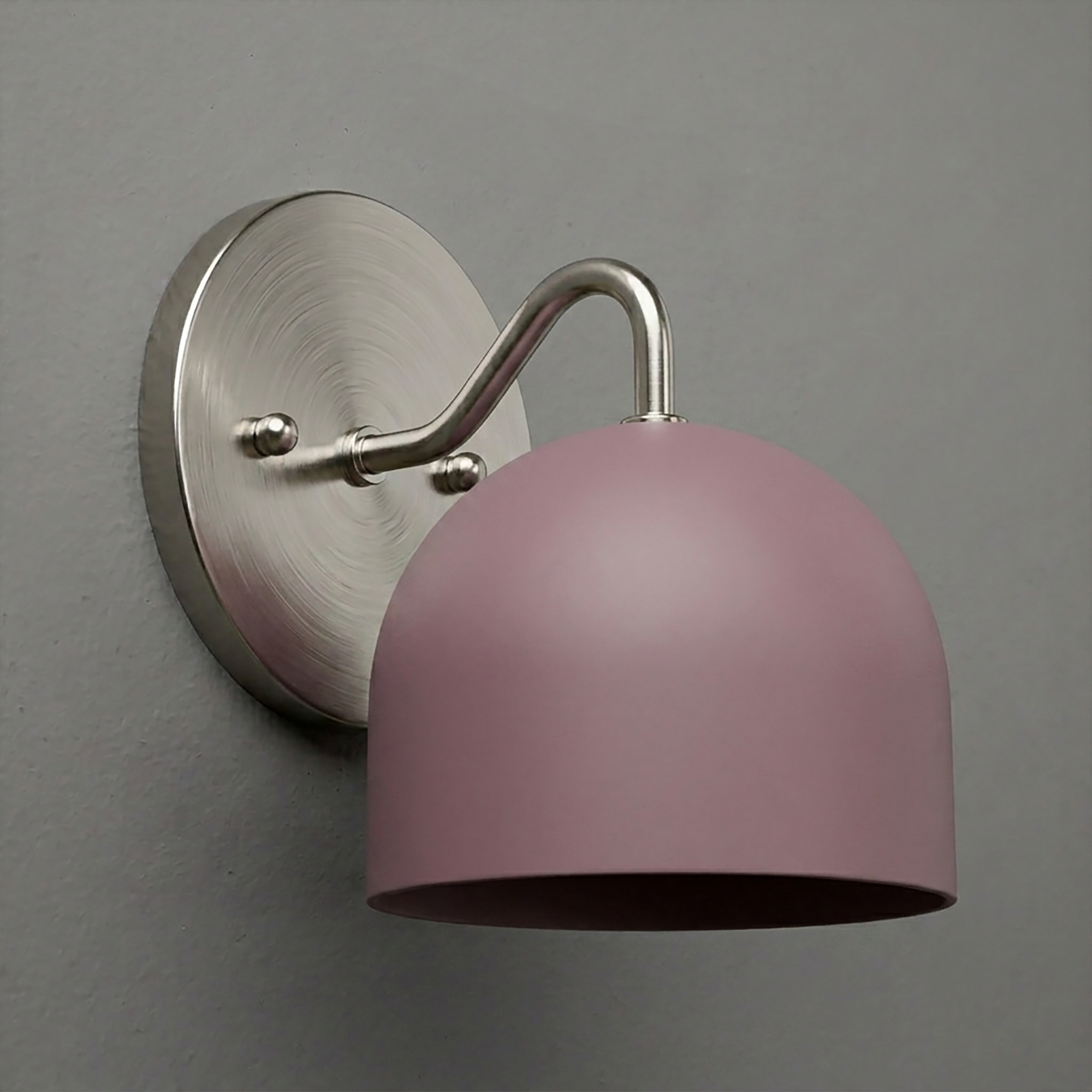 Matte pink dome-shaped metal wall sconce with brushed nickel curved arm and round backplate. - SCONCE MODEL NO. 9436