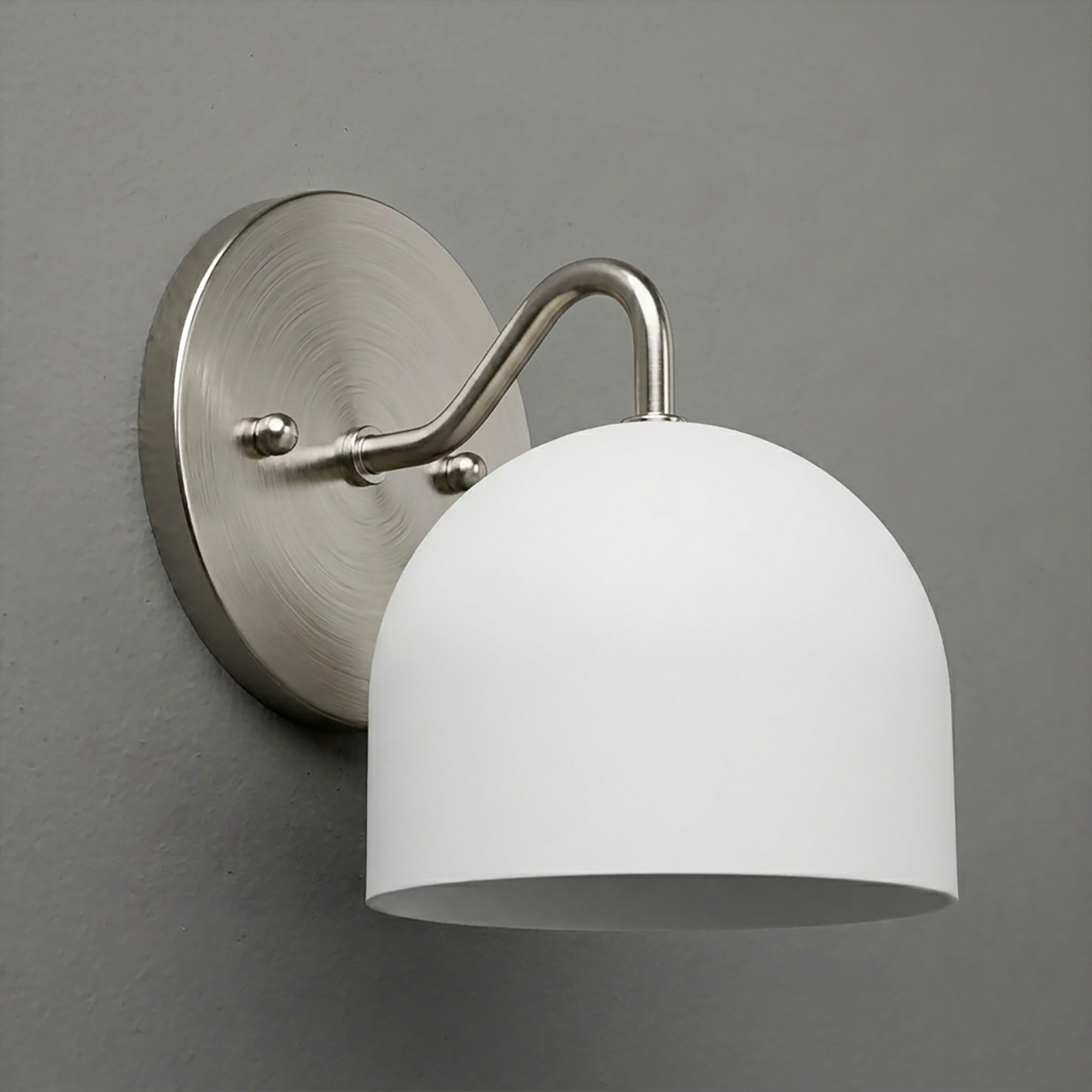 Brushed nickel wall sconce with curved arm and white dome-shaped glass shade. - SCONCE MODEL NO. 9436