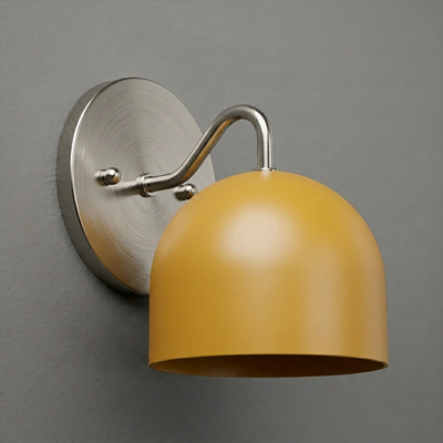 Brushed metal wall sconce with curved arm and matte mustard yellow dome-shaped shade. - SCONCE MODEL NO. 9436