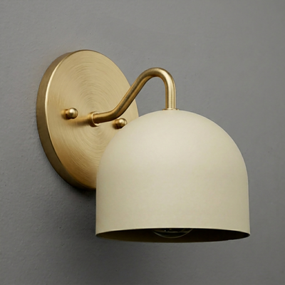 Brushed brass wall sconce with curved arm and matte cream dome-shaped metal shade. - SCONCE MODEL NO. 9436