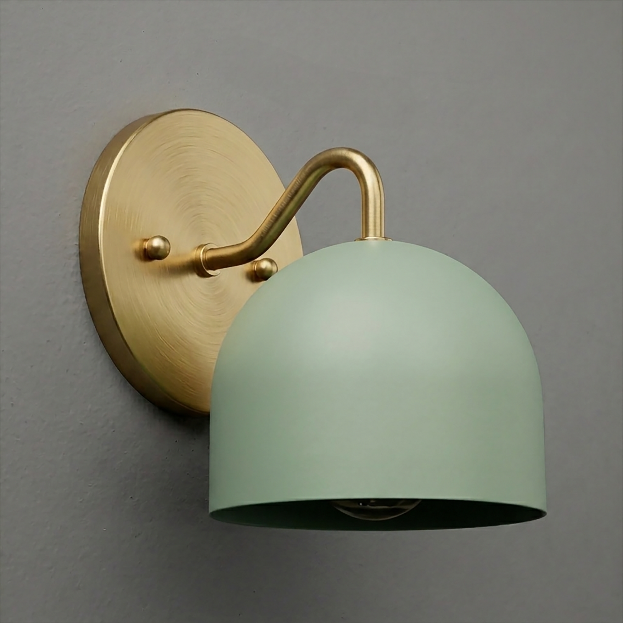 Matte brass wall sconce with curved arm and dome-shaped muted green metal shade. - SCONCE MODEL NO. 9436