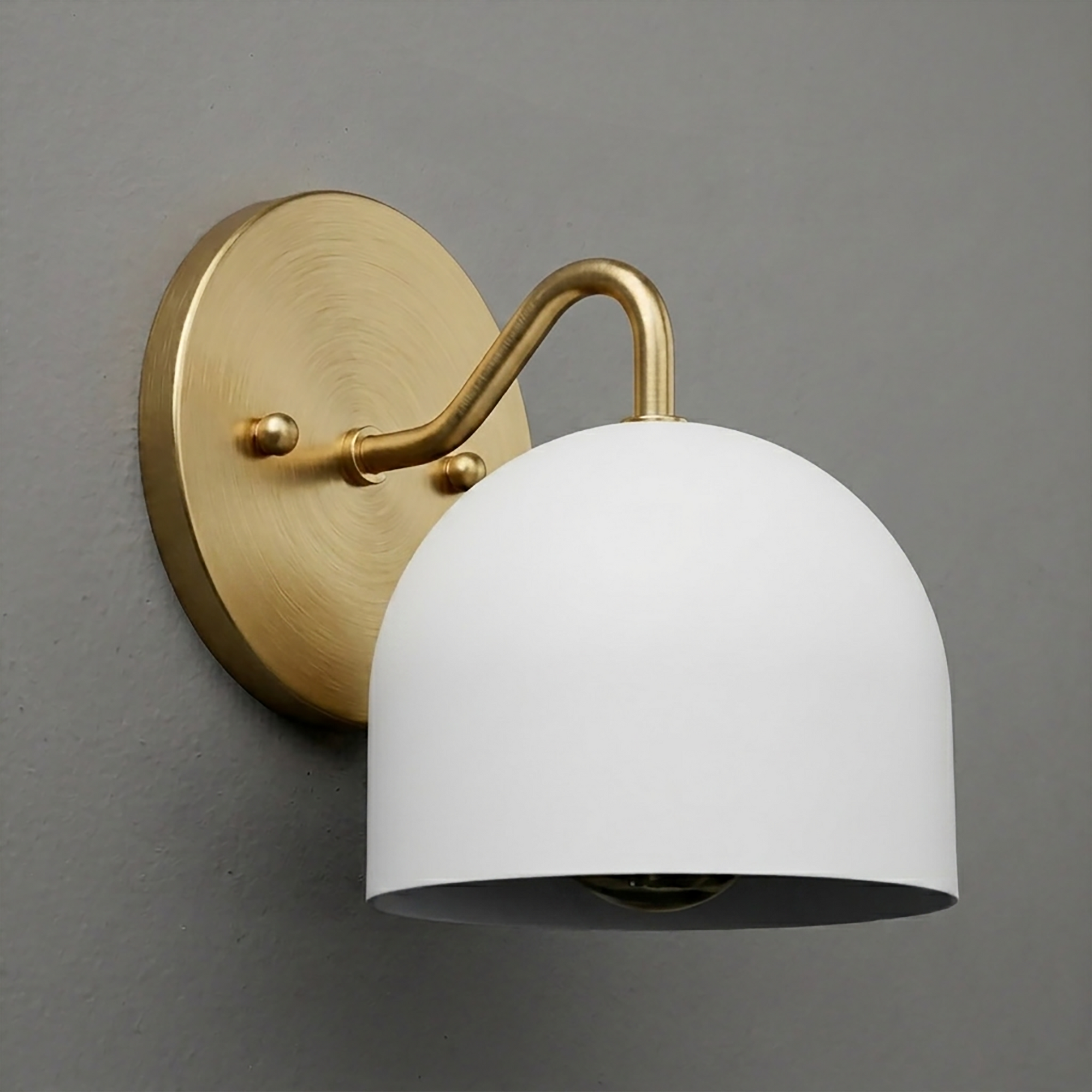 Brushed brass wall sconce with curved arm and matte white dome-shaped shade. - SCONCE MODEL NO. 9436