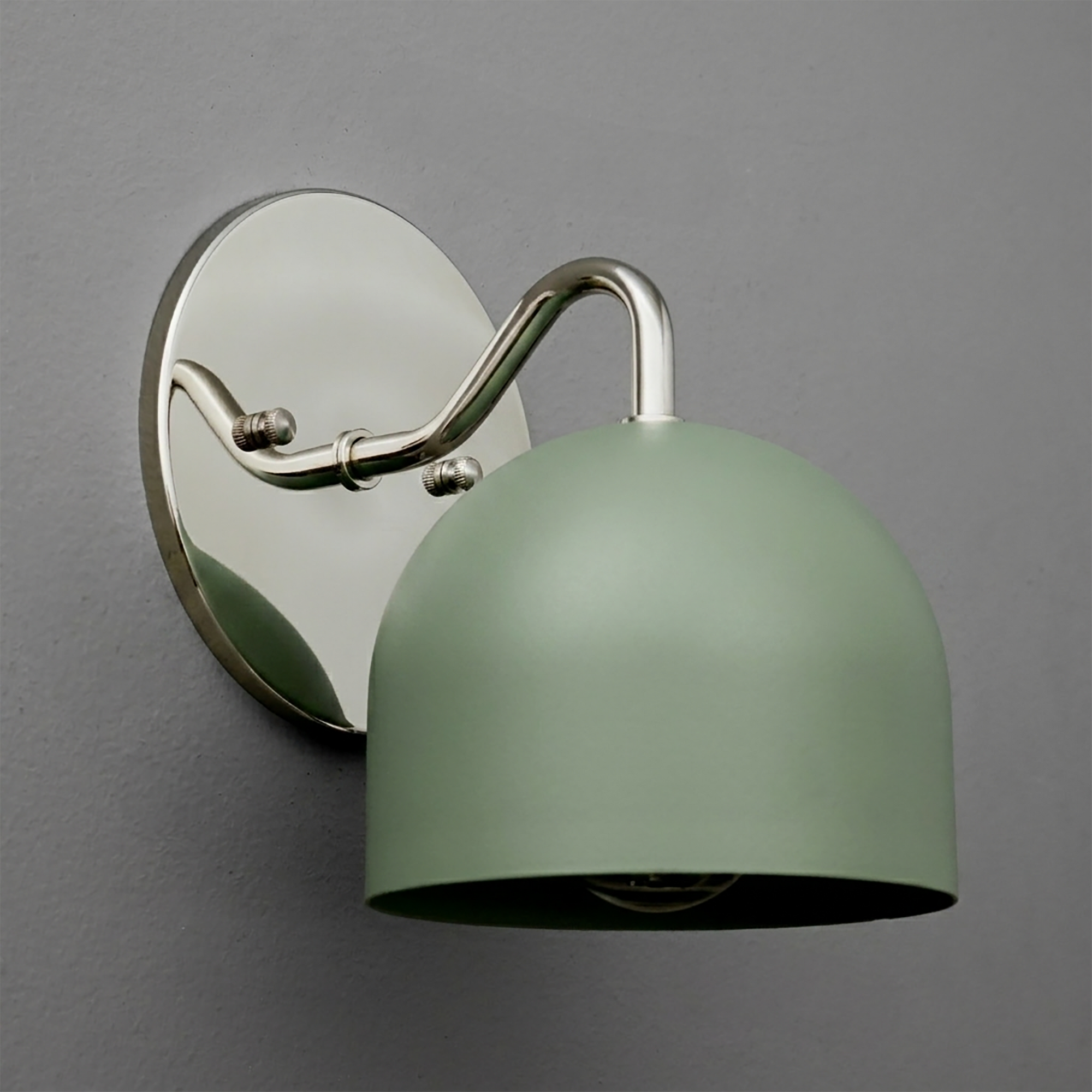 Matte sage green metal dome sconce with brushed nickel curved arm and oval backplate. - SCONCE MODEL NO. 9436