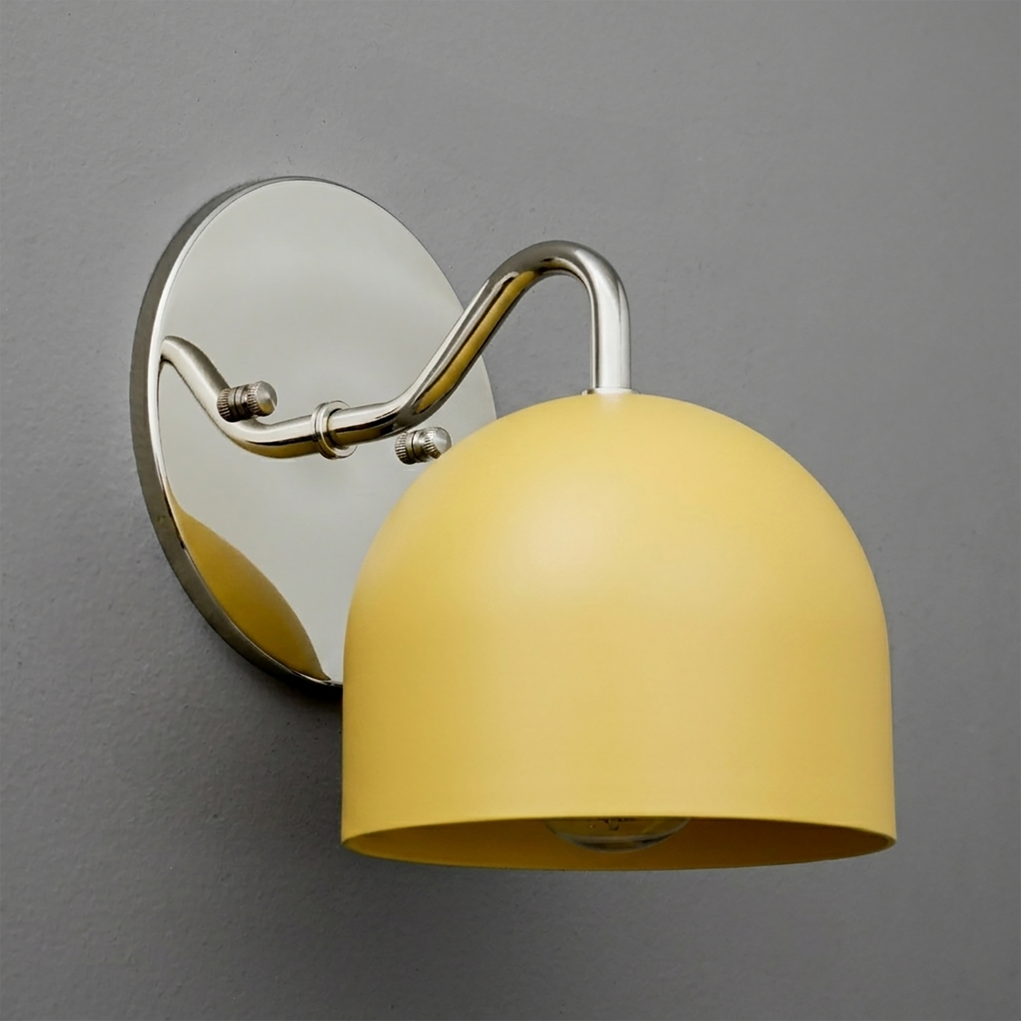 Yellow dome-shaped metal wall sconce with chrome arm and round chrome wall mount. - SCONCE MODEL NO. 9436
