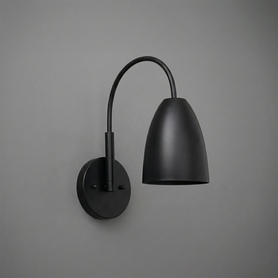 Matte black metal wall sconce with curved arm and tapered cylindrical shade. - SCONCE MODEL NO. 2977