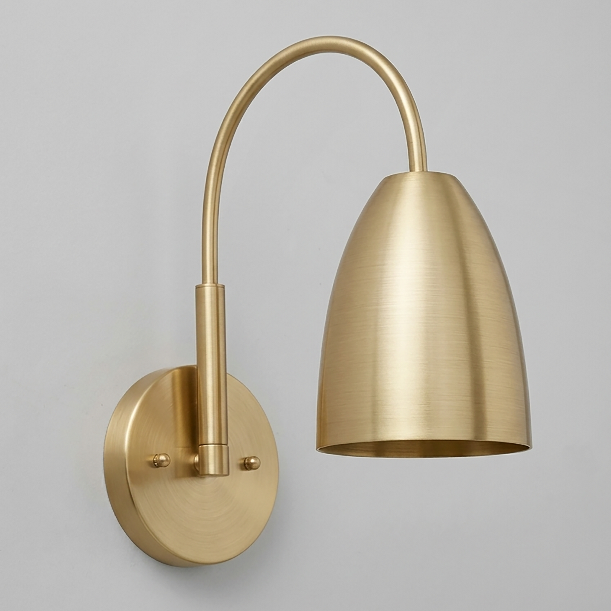 Brushed brass wall sconce with curved arm and tapered cylindrical shade, round wall mount. - SCONCE MODEL NO. 2977