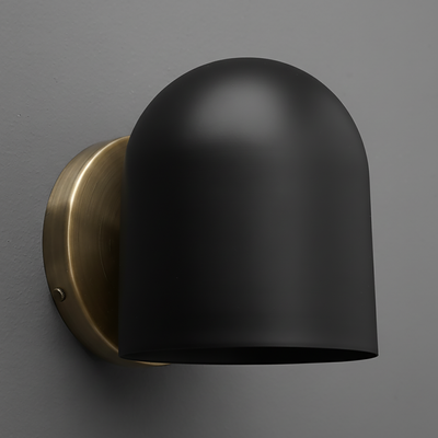 Matte black dome-shaped metal sconce with antique brass round wall mount against gray background. - SCONCE MODEL NO. 2424