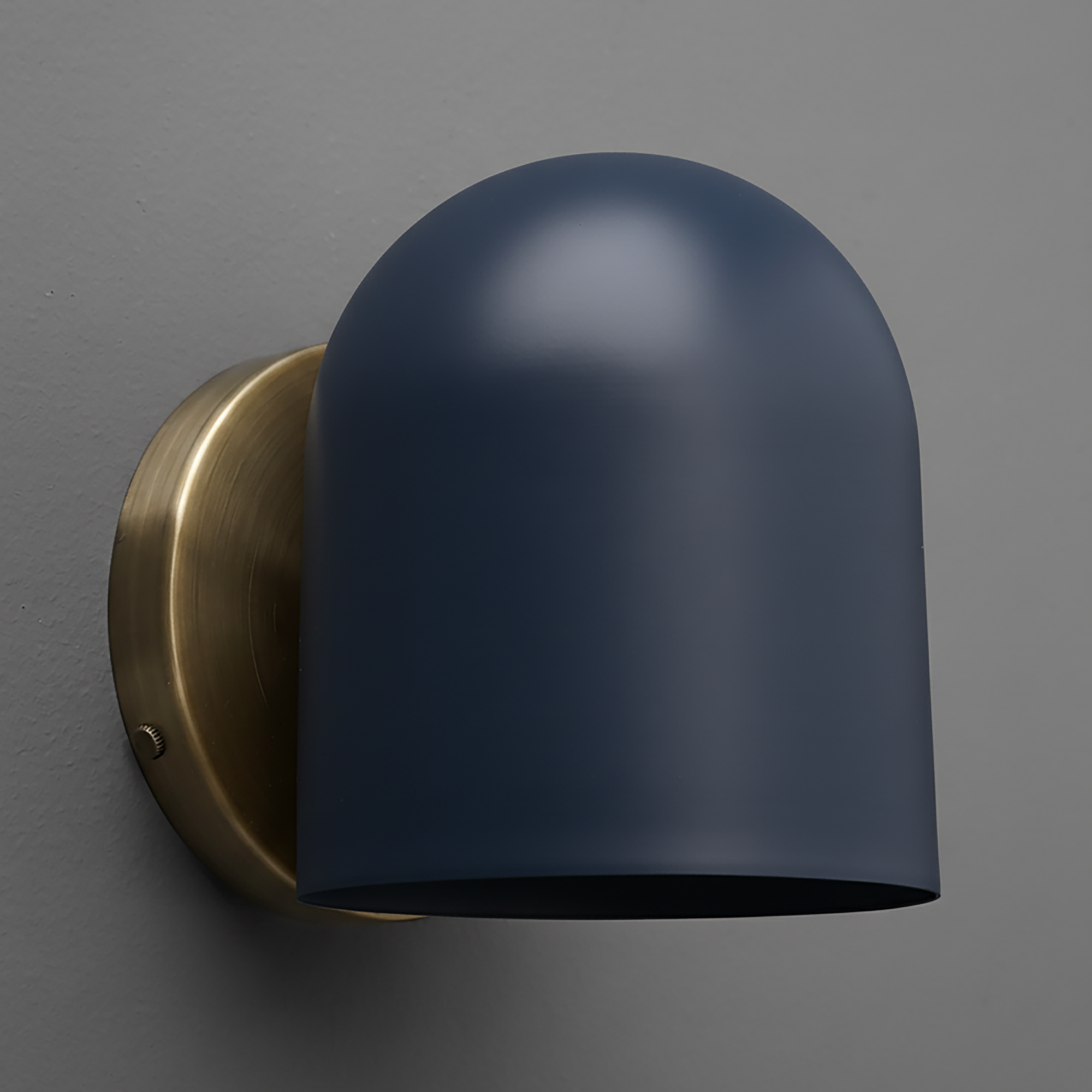 Matte navy blue dome-shaped metal sconce with brushed brass circular wall mount. - SCONCE MODEL NO. 2424
