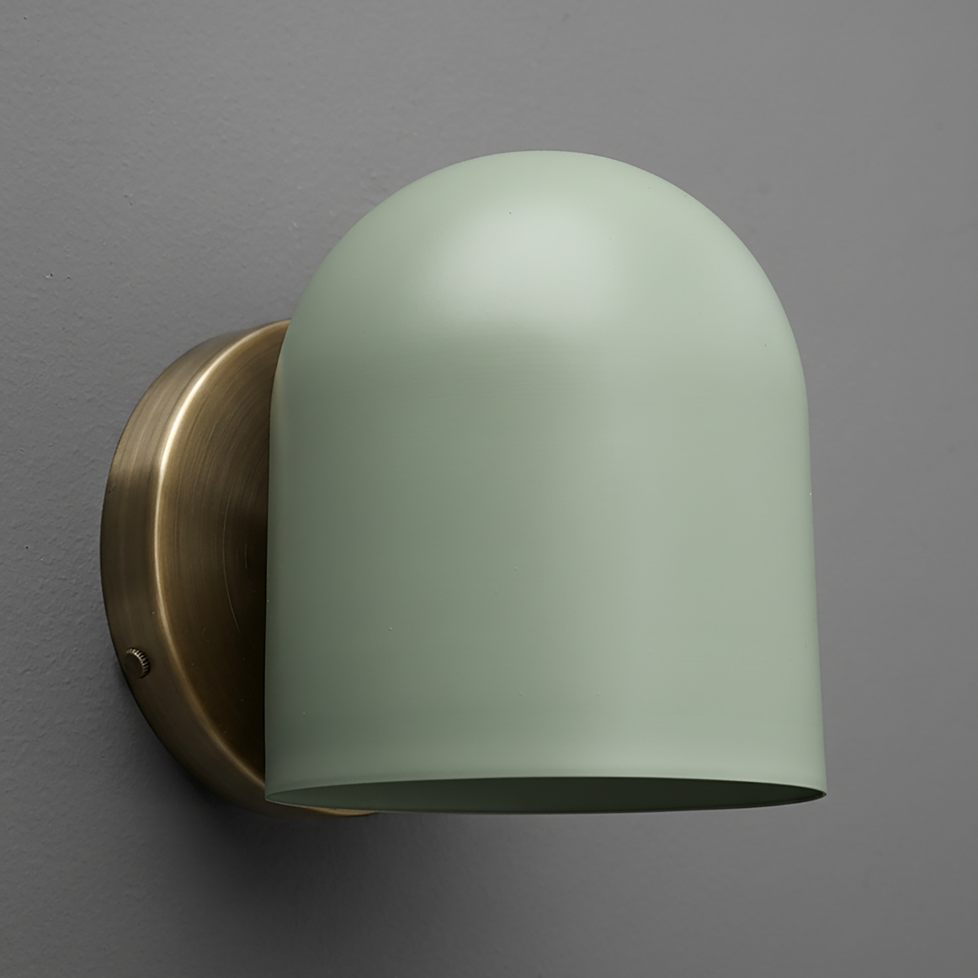 Matte light green dome-shaped metal sconce with antique brass round wall mount. - SCONCE MODEL NO. 2424