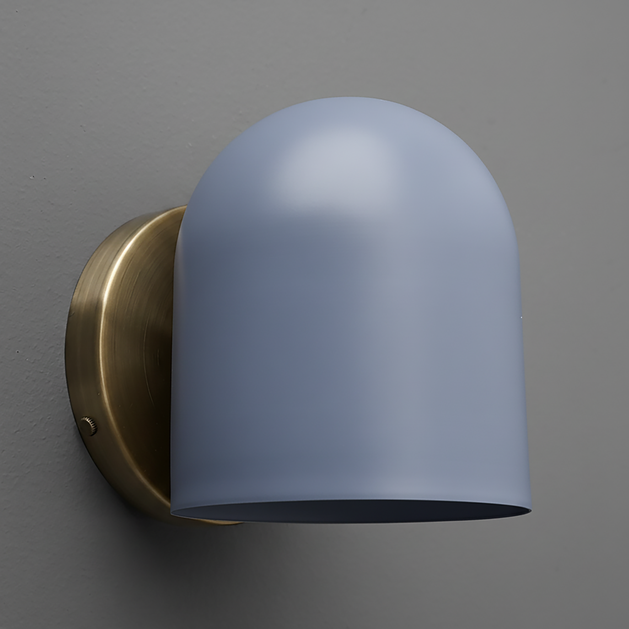 Matte brass wall sconce with smooth, curved light blue glass shade. - SCONCE MODEL NO. 2424