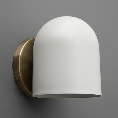 Wall sconce with matte white dome-shaped glass shade and antique brass finish metal base. - SCONCE MODEL NO. 2424