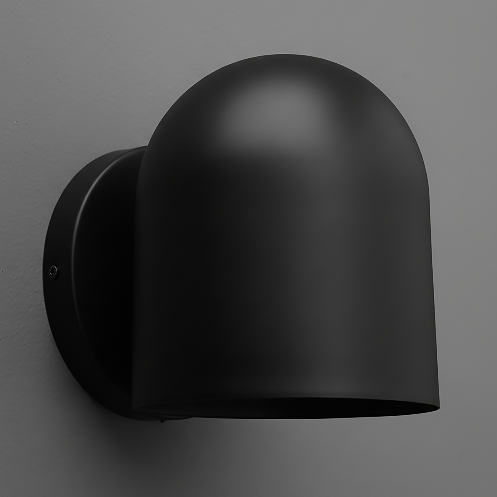 Matte black metal wall sconce with rounded dome-shaped shade and circular mounting plate. - SCONCE MODEL NO. 2424
