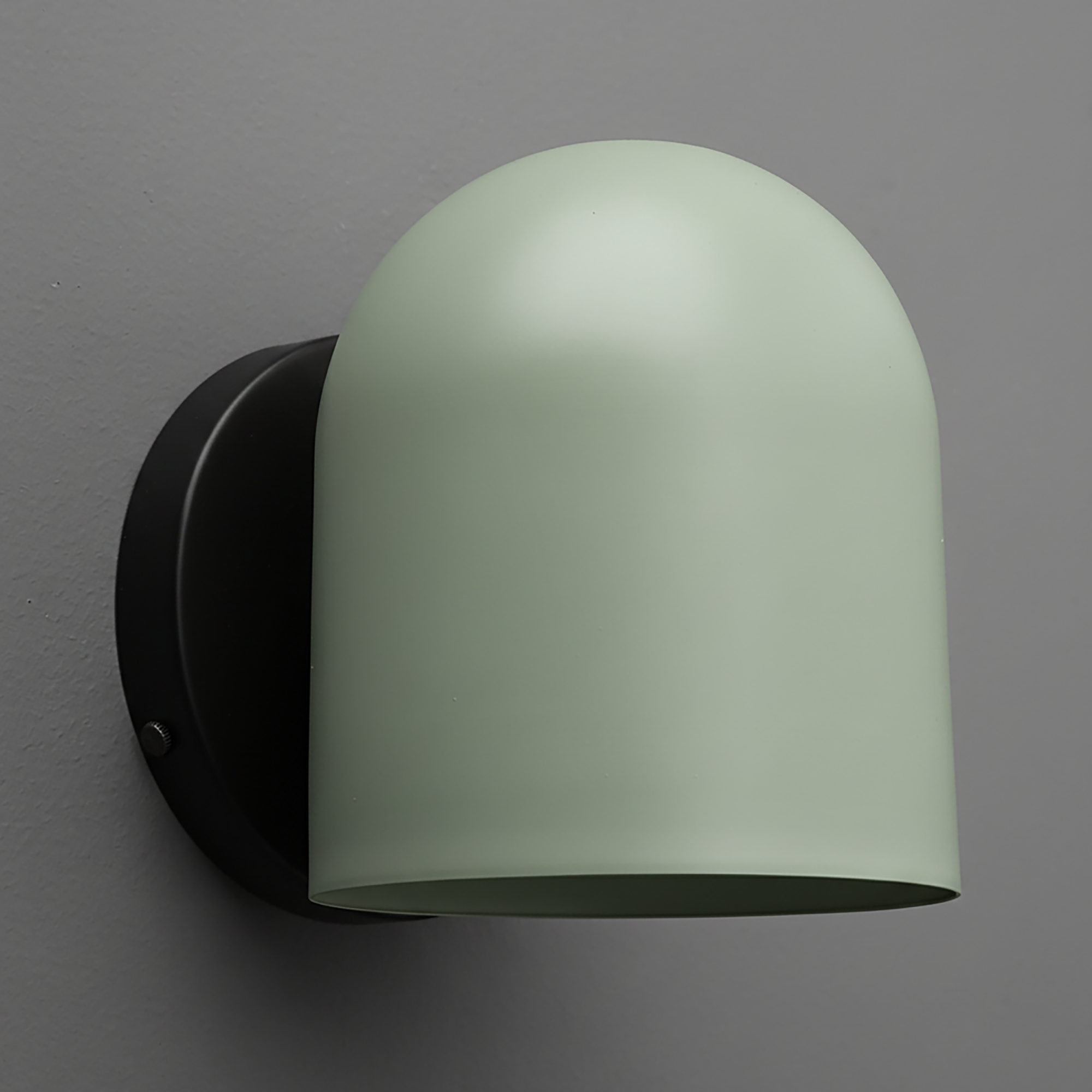 Matte sage green dome-shaped metal sconce with black circular wall mount. - SCONCE MODEL NO. 2424