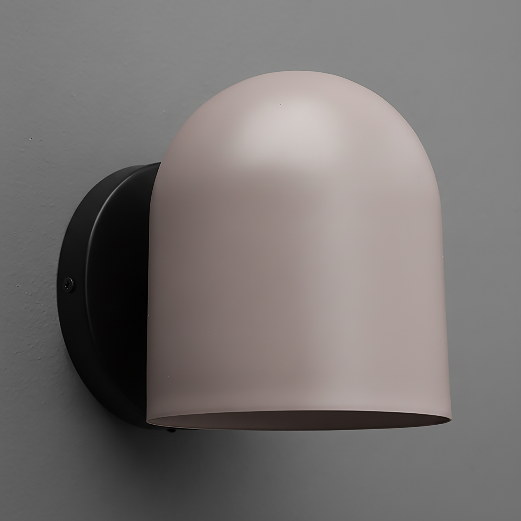 Matte black wall sconce with a smooth, curved beige shade and rounded top. - SCONCE MODEL NO. 2424