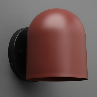 Matte terracotta dome-shaped sconce with black round mounting base on gray wall. - SCONCE MODEL NO. 2424