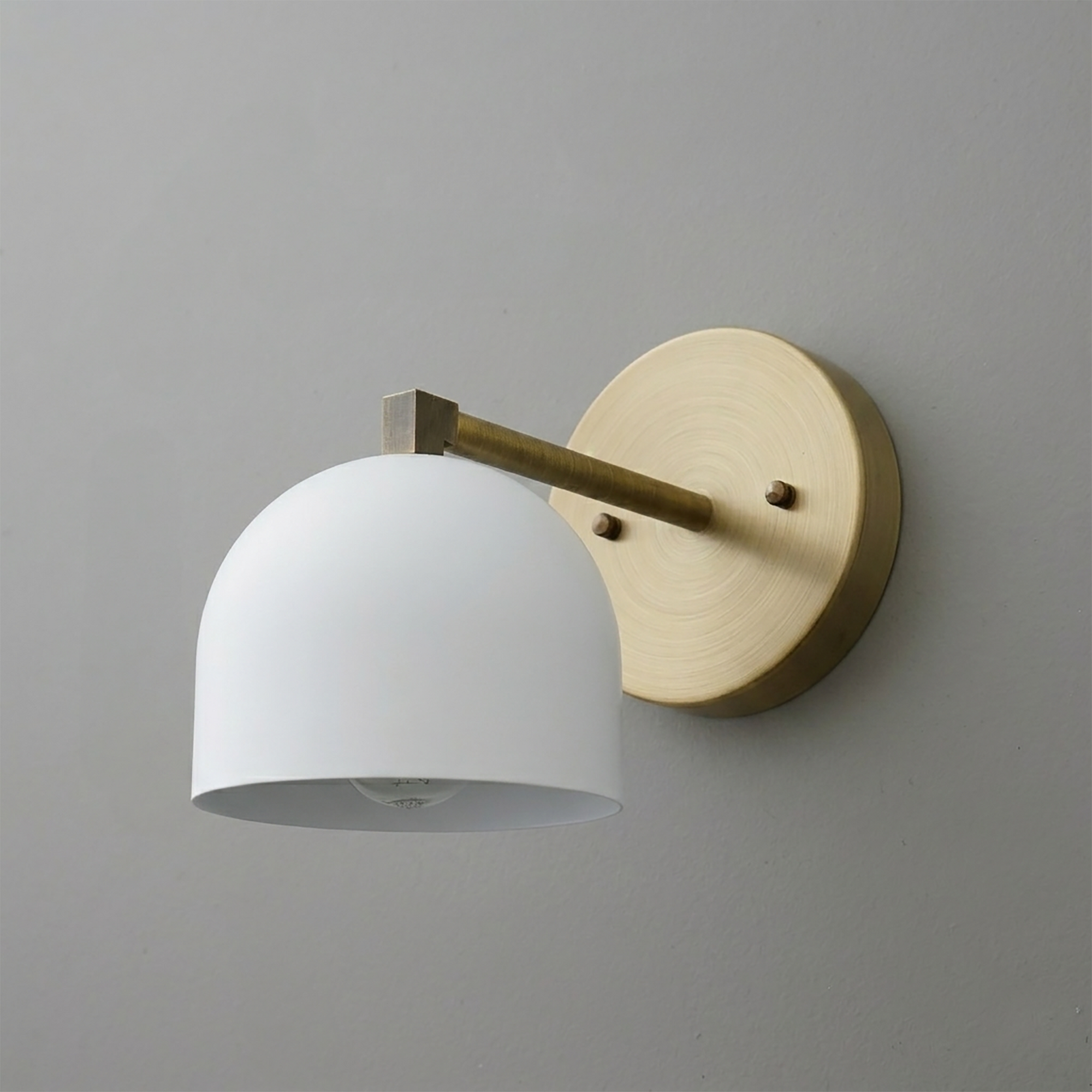 Wall sconce with round brass base, straight arm, and matte white dome-shaped shade. - SCONCE MODEL NO. 3622