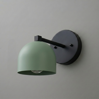 Matte black wall sconce with a curved arm and matte sage green dome-shaped metal shade covering one bulb. - SCONCE MODEL NO. 3622