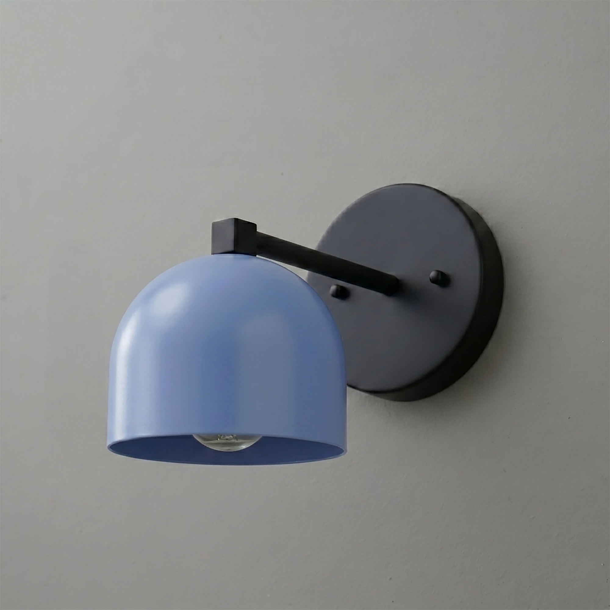 Black metal wall sconce with a matte finish and a smooth, dome-shaped blue shade from the Deep Ball Collection. - SCONCE MODEL NO. 3622