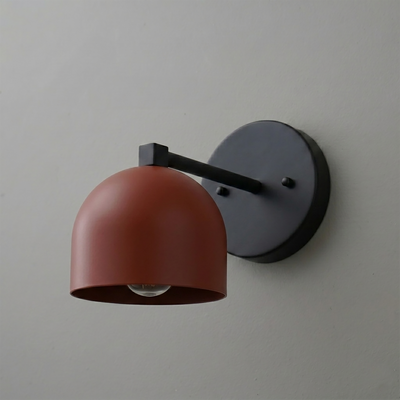 Matte black metal wall sconce with a rust-colored dome-shaped shade and exposed bulb. - SCONCE MODEL NO. 3622