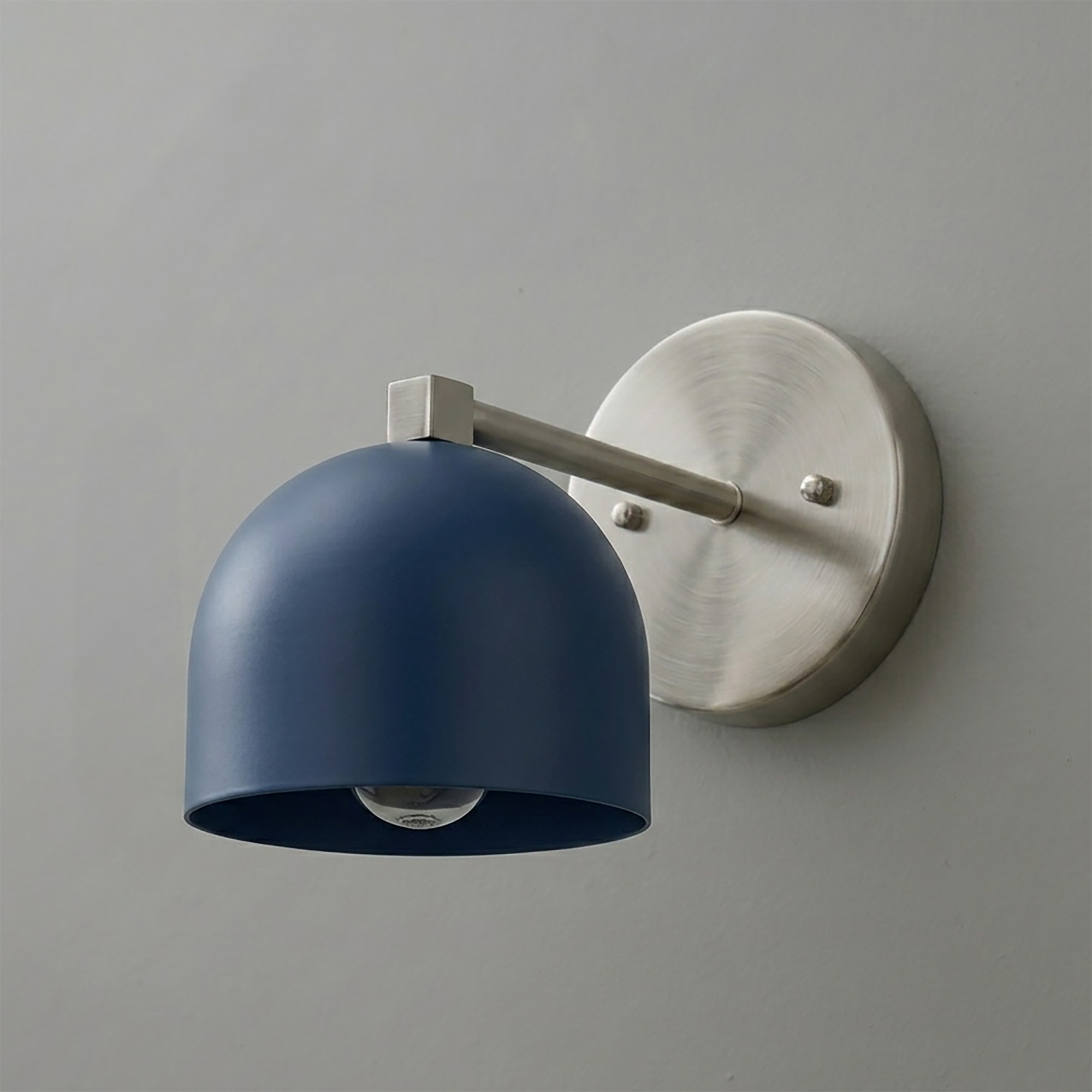 Wall-mounted sconce with a deep matte navy blue metal shade and brushed nickel arm and round base. - SCONCE MODEL NO. 3622