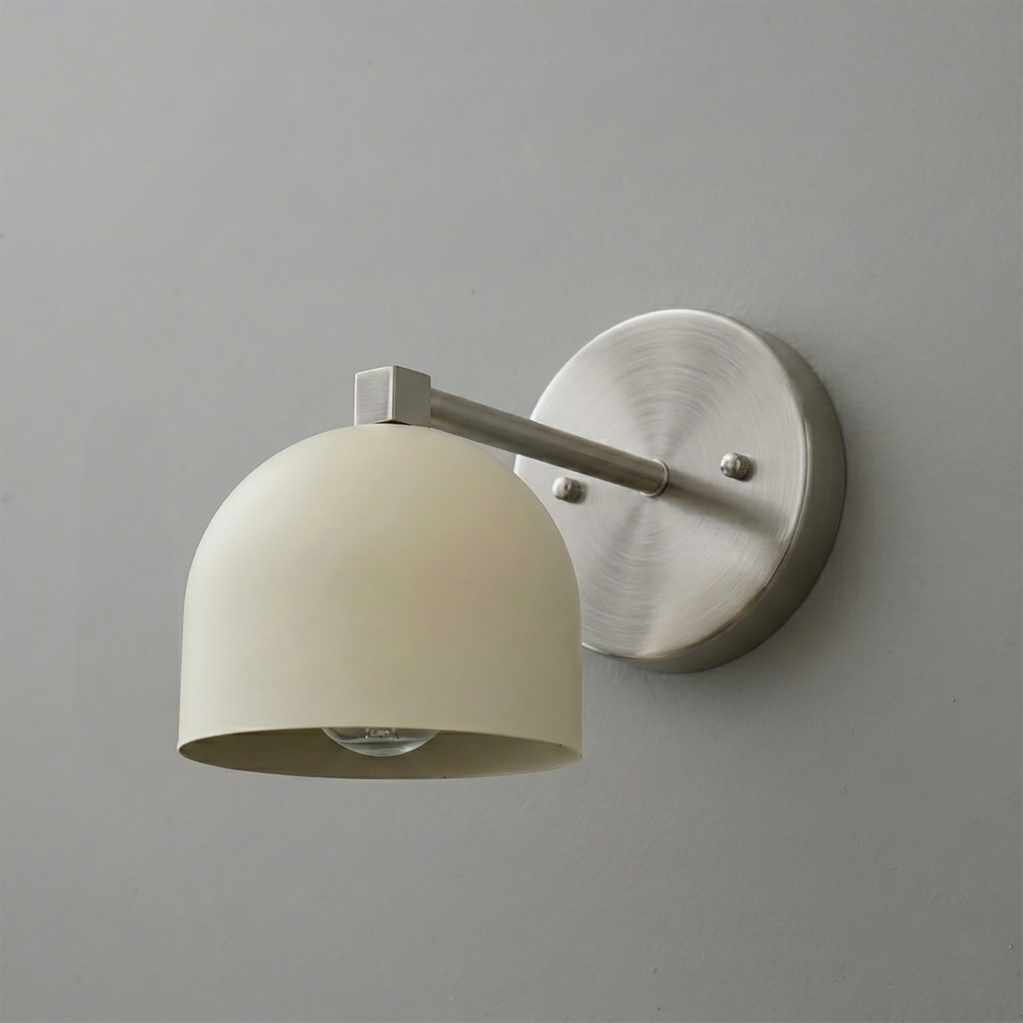 Brushed metal wall sconce with a matte white dome-shaped shade and single exposed bulb design. - SCONCE MODEL NO. 3622