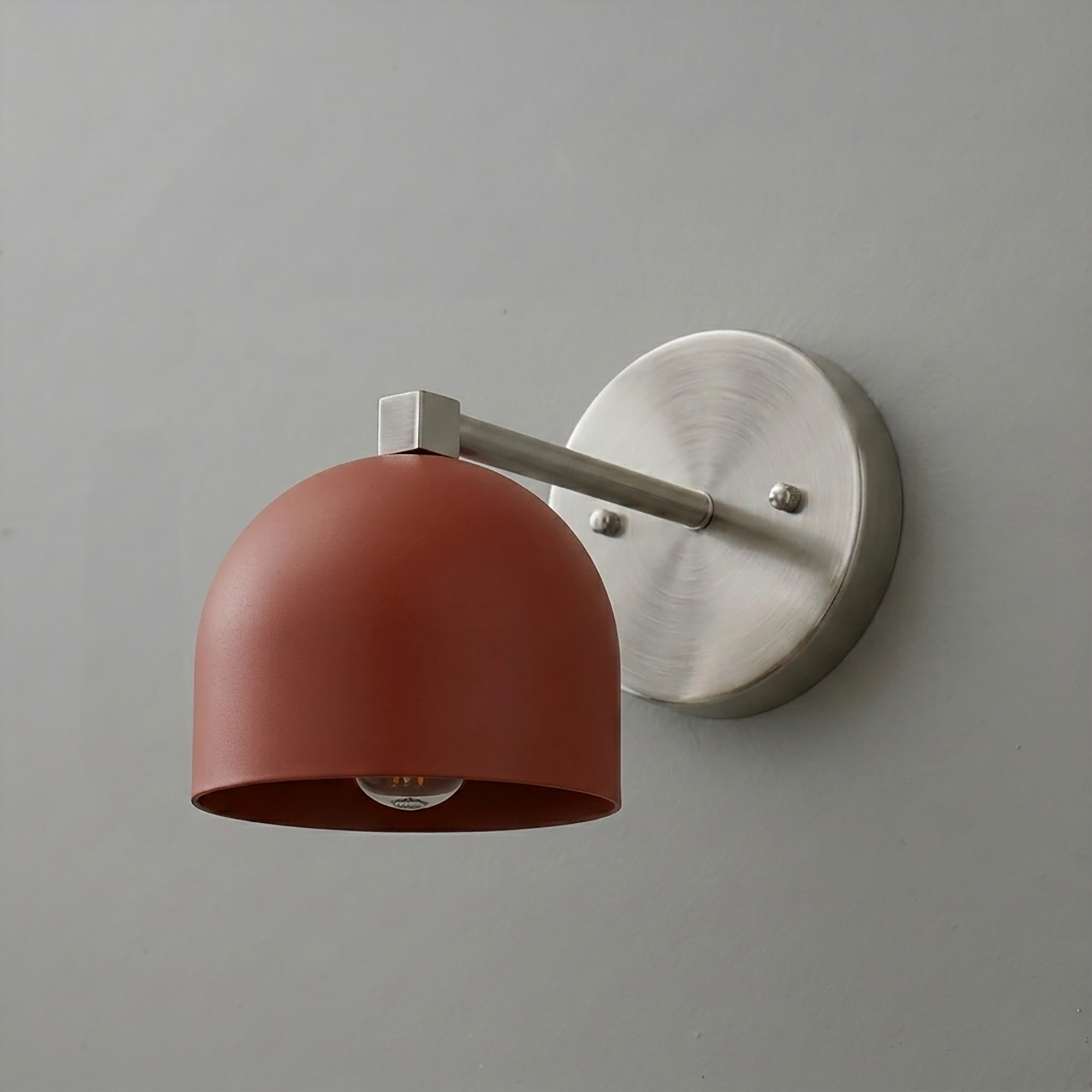 Wall-mounted sconce with a matte terracotta dome-shaped shade and brushed nickel arm and round base plate. - SCONCE MODEL NO. 3622