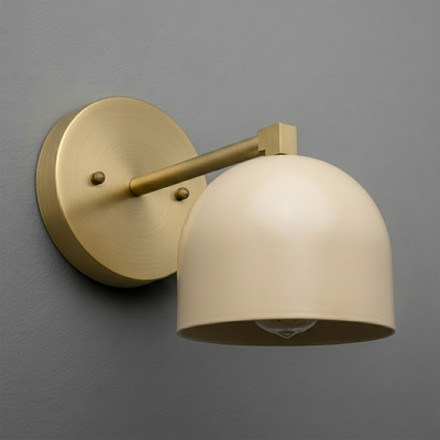 Brushed brass wall sconce with beige dome-shaped shade and single exposed bulb design. - SCONCE MODEL NO. 3622