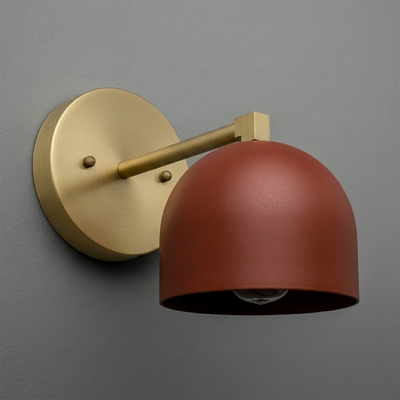 Wall sconce with round brushed brass base and arm, featuring a deep matte rust-colored dome shade. - SCONCE MODEL NO. 3622