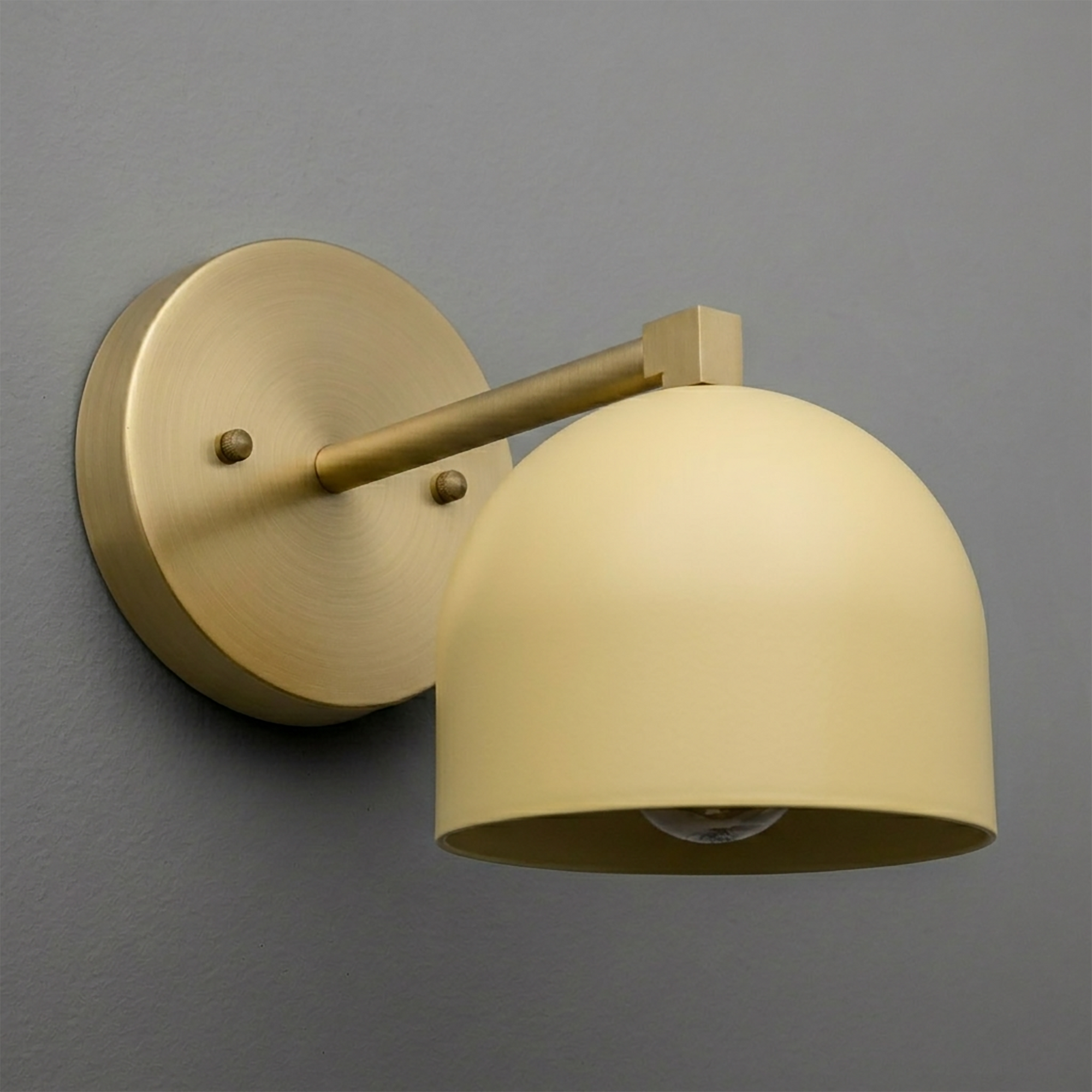 Matte brass wall sconce with a smooth, dome-shaped cream glass shade and round backplate. - SCONCE MODEL NO. 3622