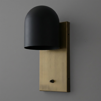 Wall sconce with matte black dome shade and rectangular brushed brass backplate, single bulb fixture. - SCONCE MODEL NO. 6029