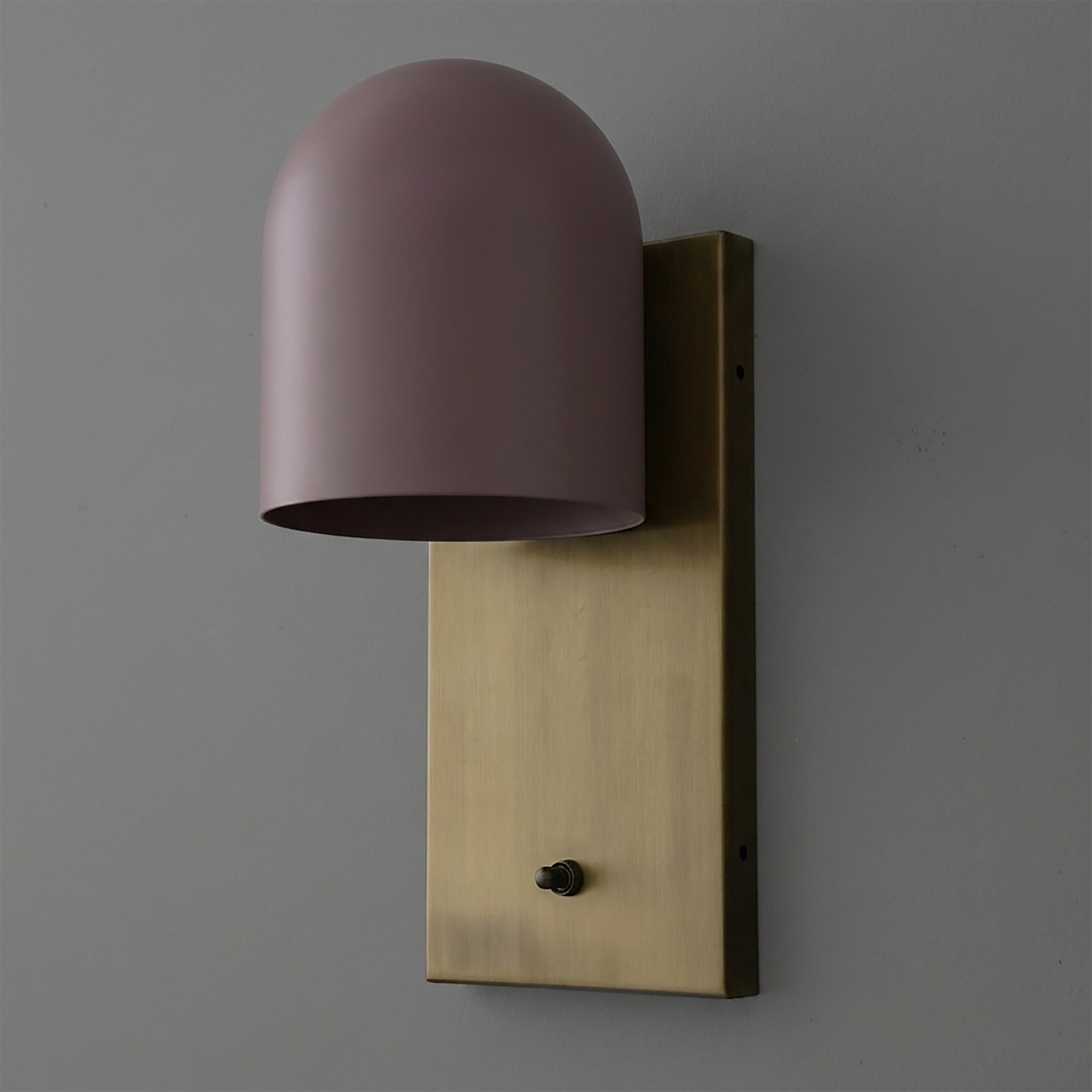 Wall sconce with a brass rectangular backplate and a matte mauve dome-shaped metal shade. - SCONCE MODEL NO. 6029