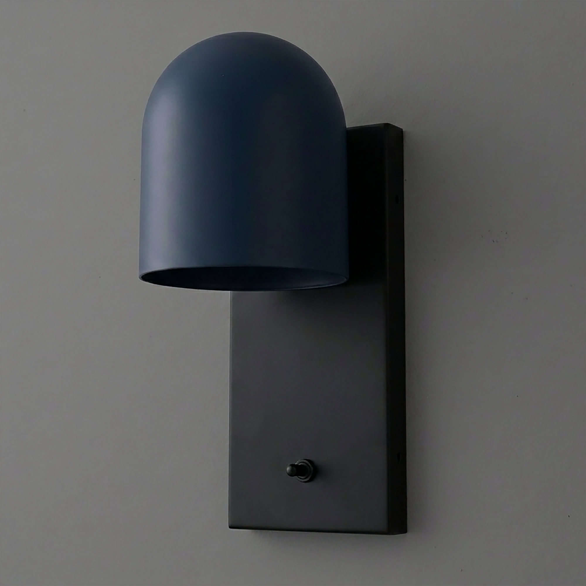 Matte black rectangular wall sconce with a rounded navy blue metal shade and a small toggle switch at the base. - SCONCE MODEL NO. 6029