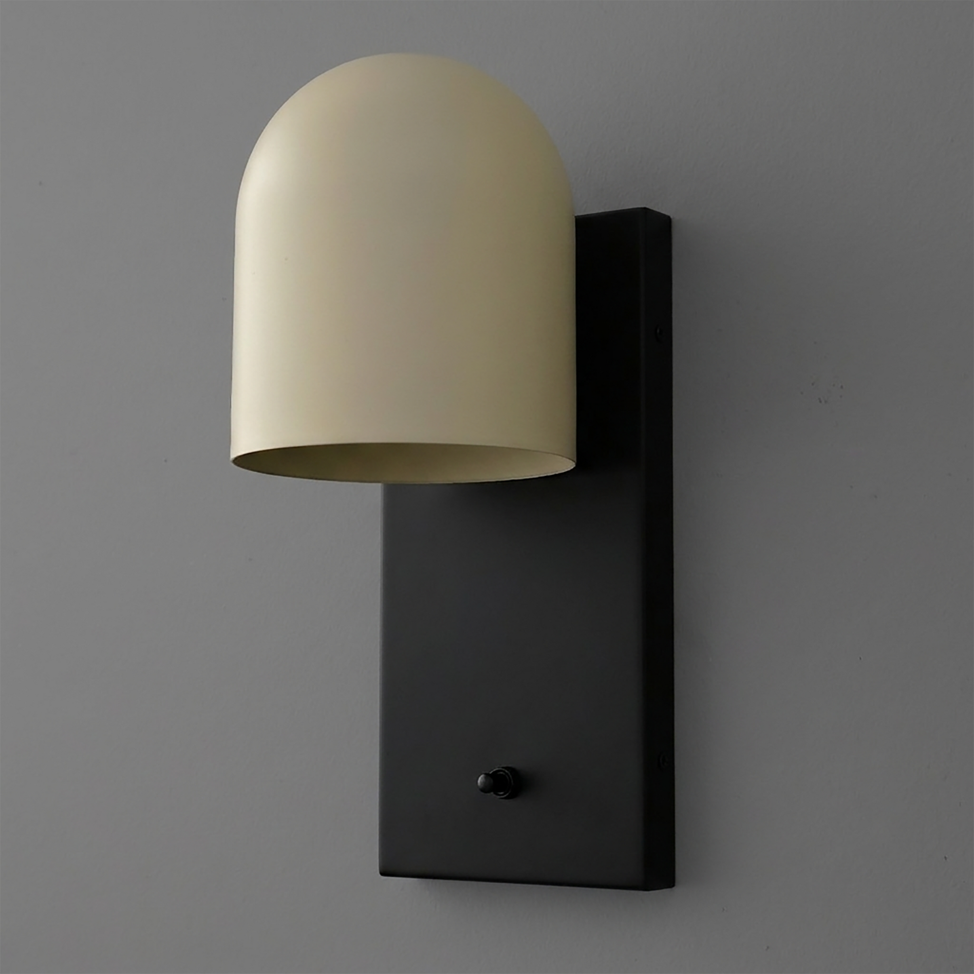 Wall sconce with matte black rectangular base and curved cream-colored metal shade. - SCONCE MODEL NO. 6029