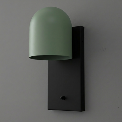 Wall sconce with matte black rectangular base and smooth matte green dome-shaped shade covering one bulb. - SCONCE MODEL NO. 6029