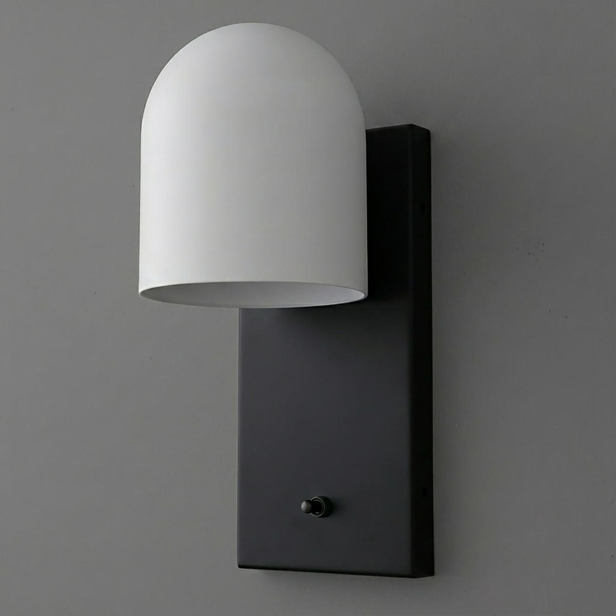 Black rectangular metal wall plate sconce with a smooth white dome-shaped shade and a small black toggle switch at the base. - SCONCE MODEL NO. 6029