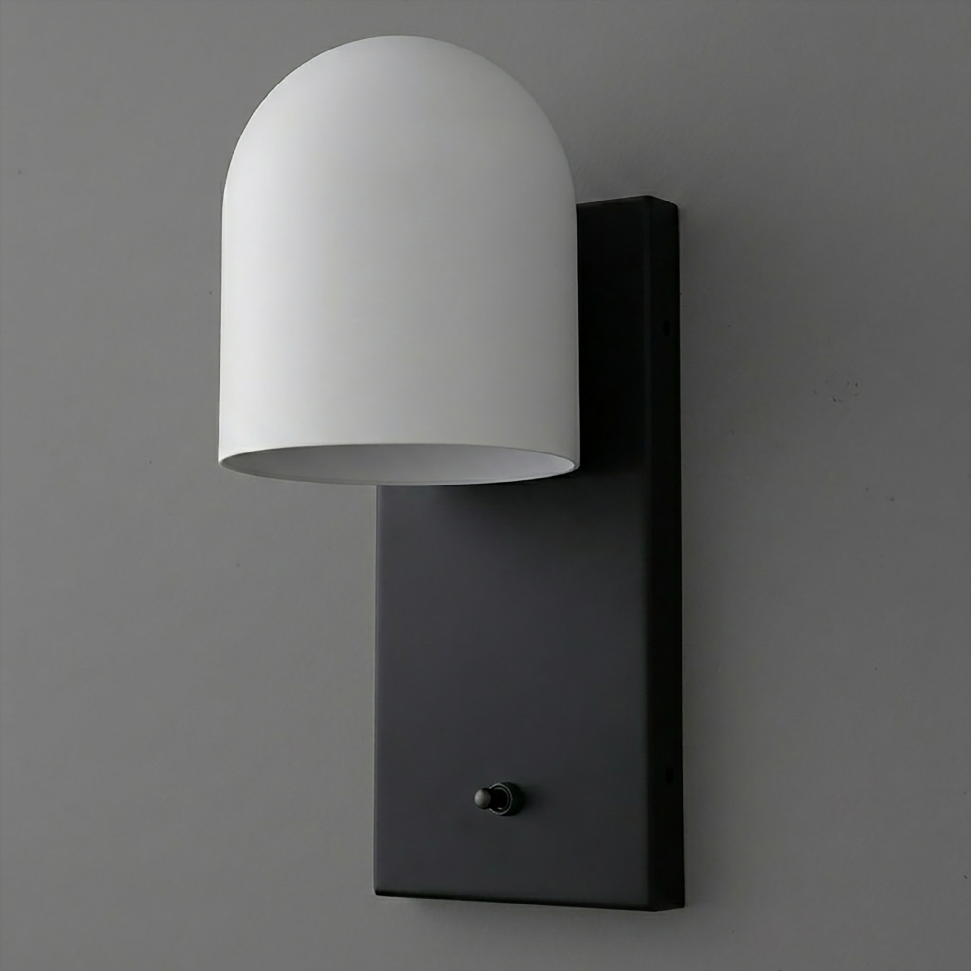 Black rectangular metal wall plate sconce with a smooth white dome-shaped shade and a small black toggle switch at the base. - SCONCE MODEL NO. 6029