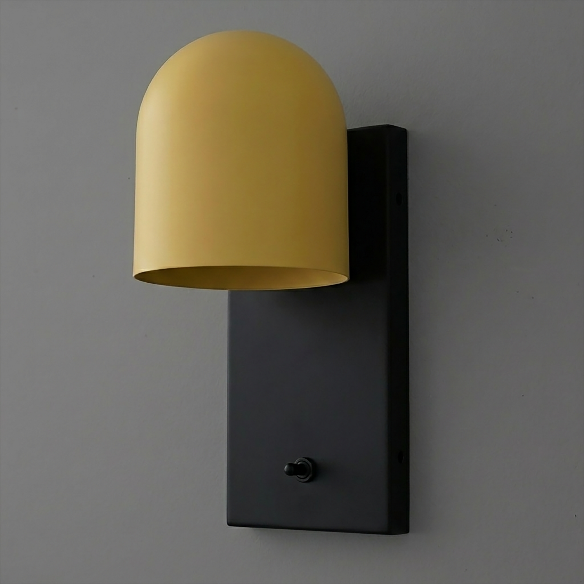 Matte black rectangular wall plate sconce with a smooth, curved mustard yellow dome shade and small black toggle switch. - SCONCE MODEL NO. 6029