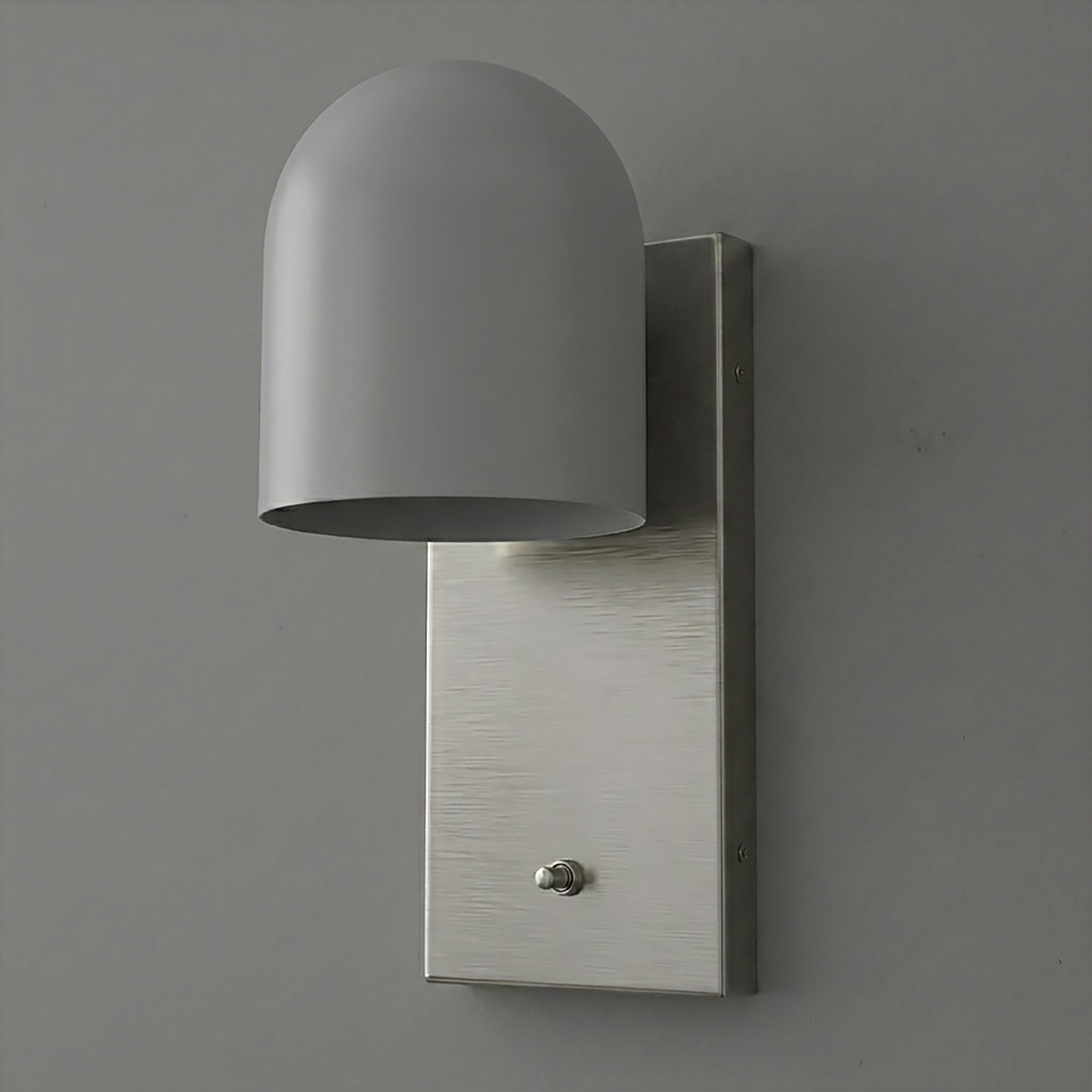 Matte gray dome-shaped metal sconce with rectangular brushed nickel backplate and single bulb design. - SCONCE MODEL NO. 6029
