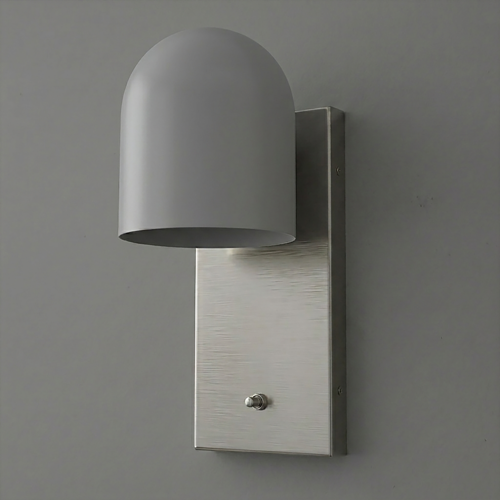 Matte gray dome-shaped metal sconce with rectangular brushed nickel backplate and single bulb design. - SCONCE MODEL NO. 6029