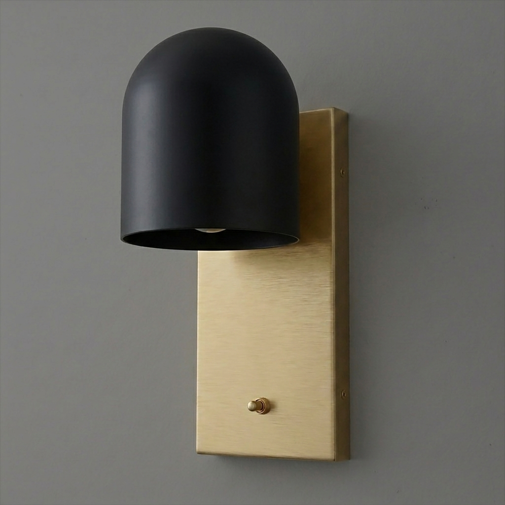Black dome-shaped metal shade wall sconce with rectangular brushed gold backplate and small toggle switch. - SCONCE MODEL NO. 6029