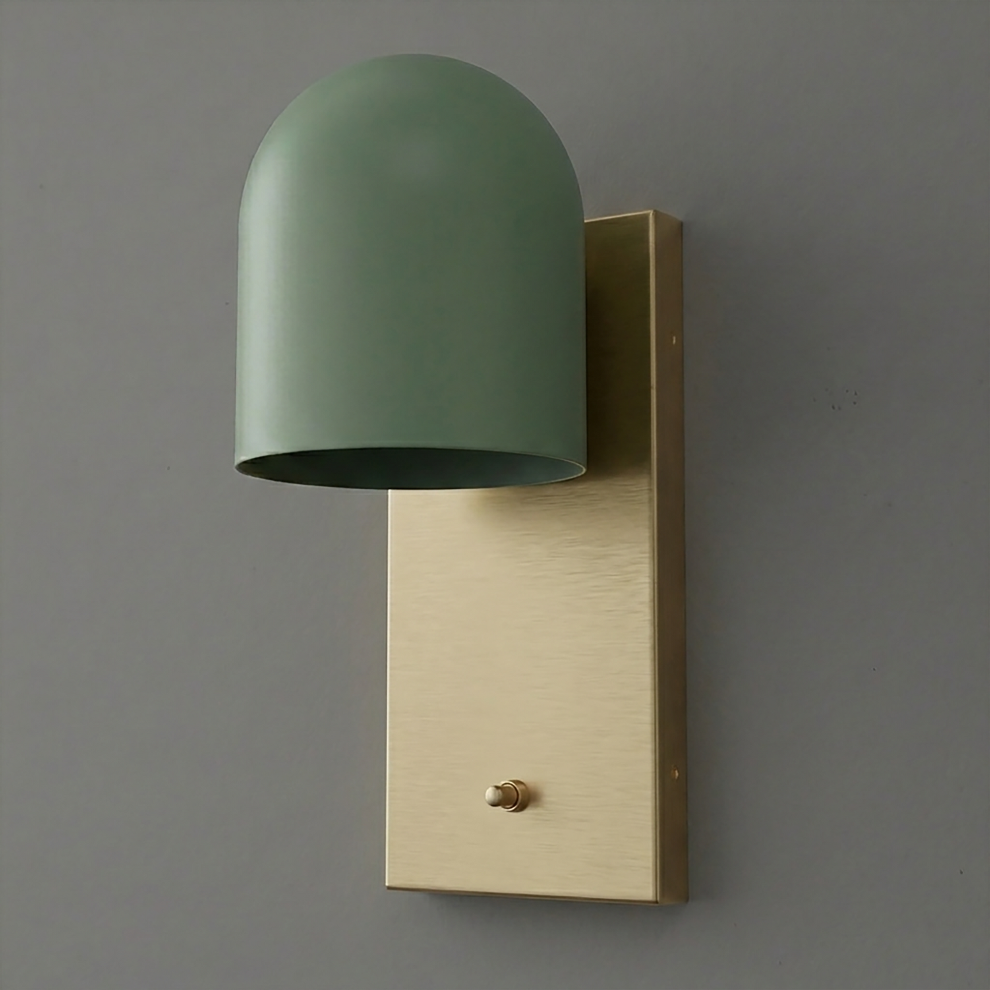 Green dome-shaped metal sconce with brushed brass rectangular backplate and small brass toggle switch. - SCONCE MODEL NO. 6029