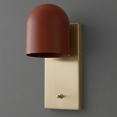 Wall sconce with matte rust-colored dome shade and rectangular brushed brass backplate with toggle switch. - SCONCE MODEL NO. 6029