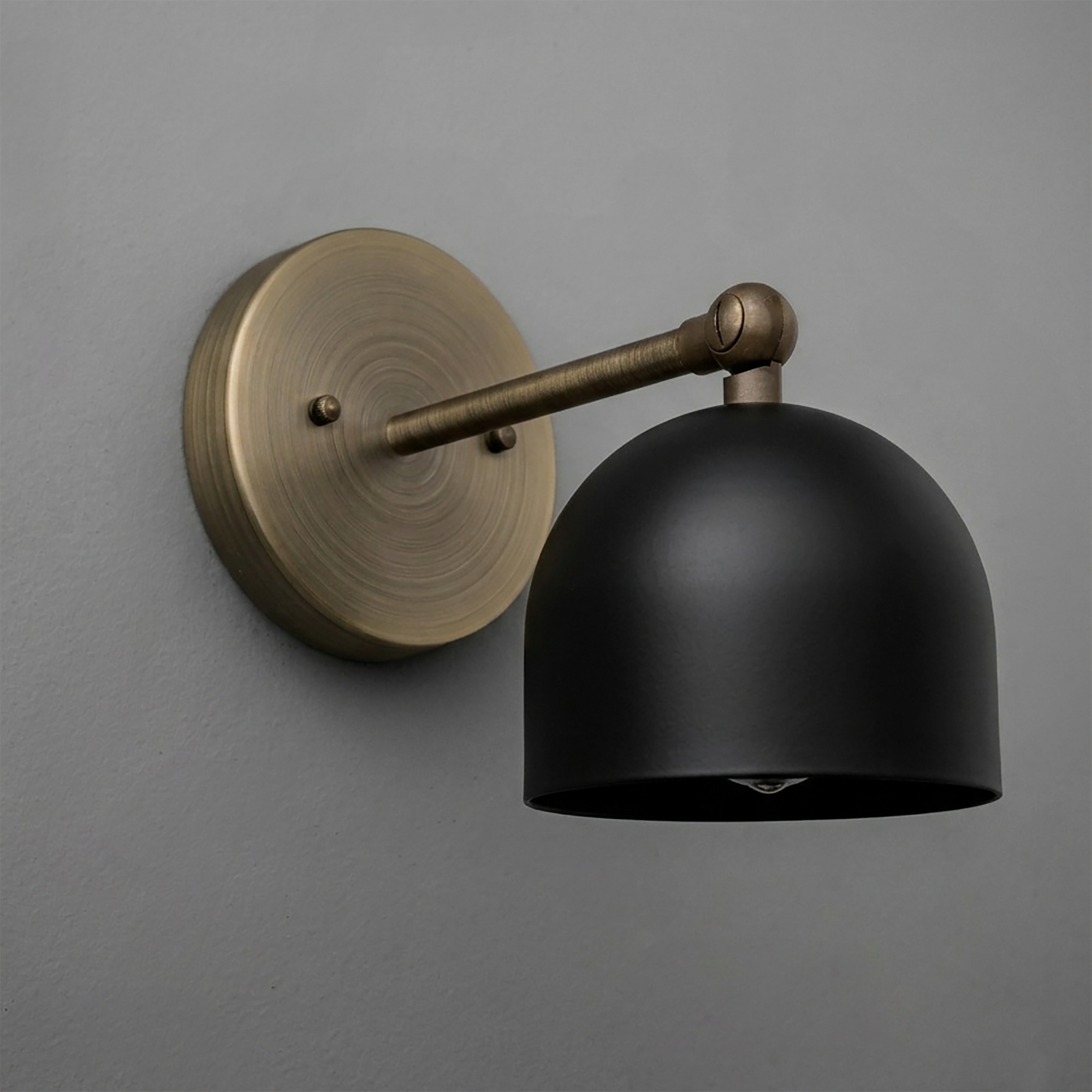 Wall-mounted sconce with matte black dome shade and antique brass circular base and arm. - SCONCE MODEL NO. 5103