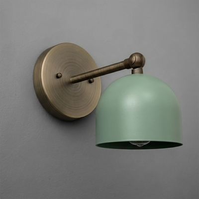 Wall-mounted single-bulb sconce with brushed brass arm and matte green dome-shaped shade. - SCONCE MODEL NO. 5103