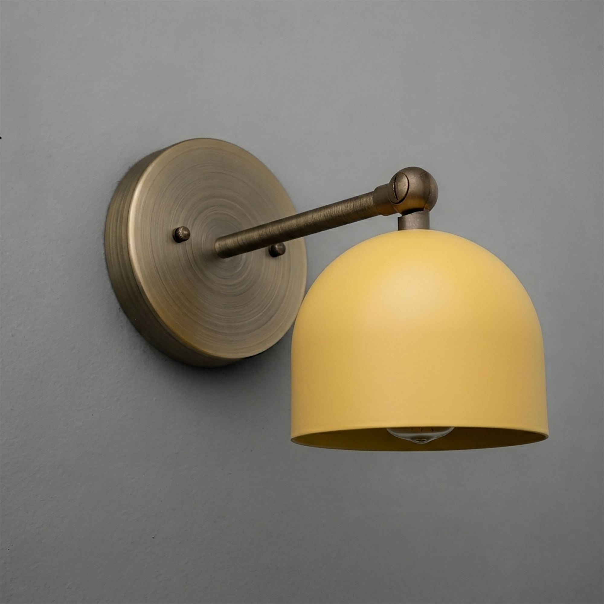Wall-mounted sconce with brushed brass arm and round mustard yellow dome shade. - SCONCE MODEL NO. 5103