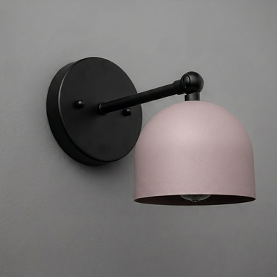 Matte black wall-mounted sconce with curved arm and matte pink dome-shaped shade. - SCONCE MODEL NO. 5103