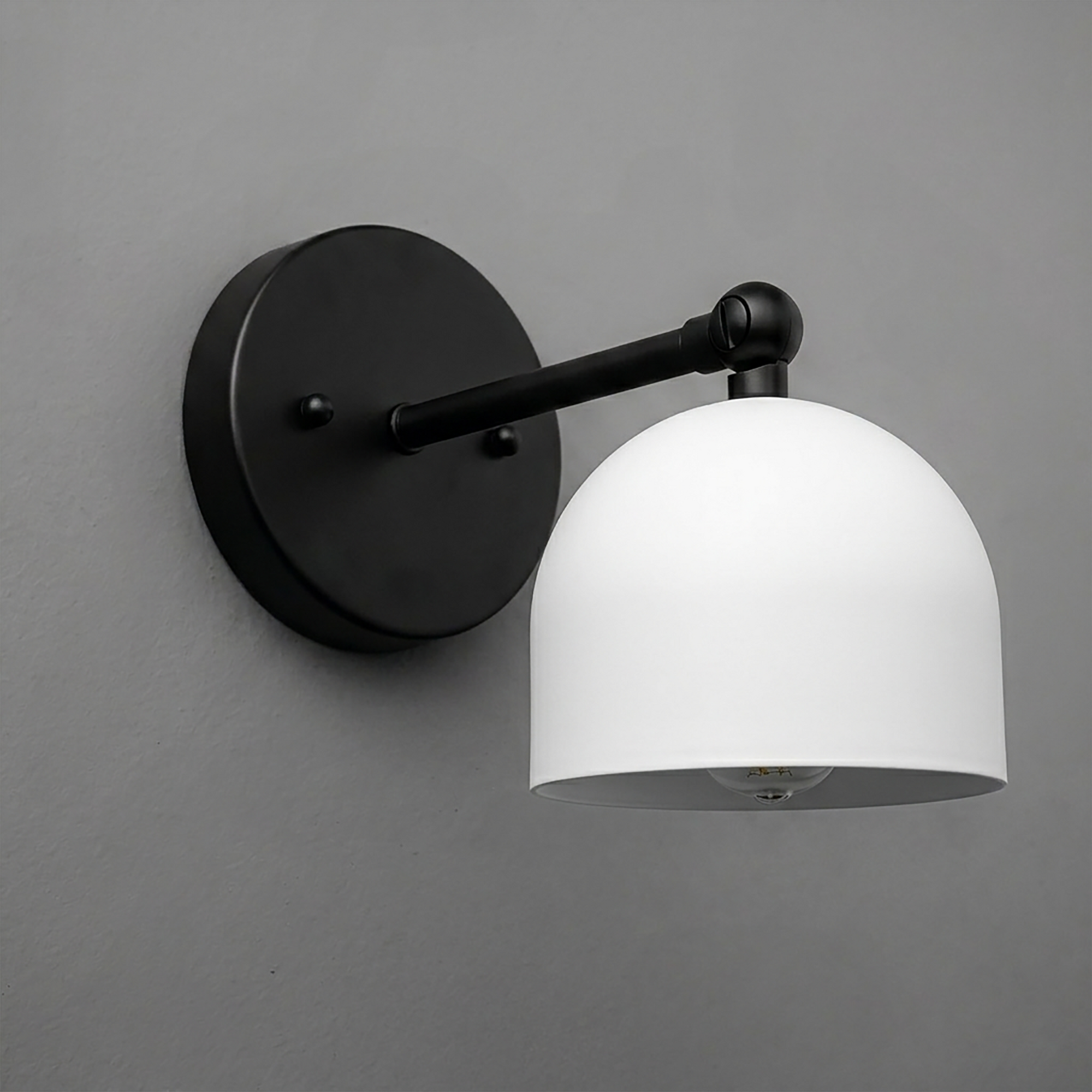 Black metal wall sconce with matte white dome-shaped glass shade and single bulb design. - SCONCE MODEL NO. 5103