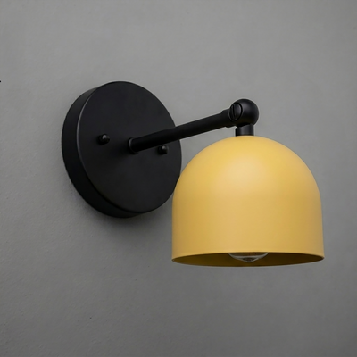 Matte black metal wall sconce with a smooth, rounded yellow shade and single exposed bulb. - SCONCE MODEL NO. 5103